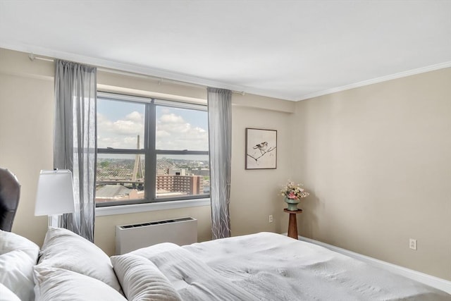 bedroom with multiple windows, radiator, and crown molding