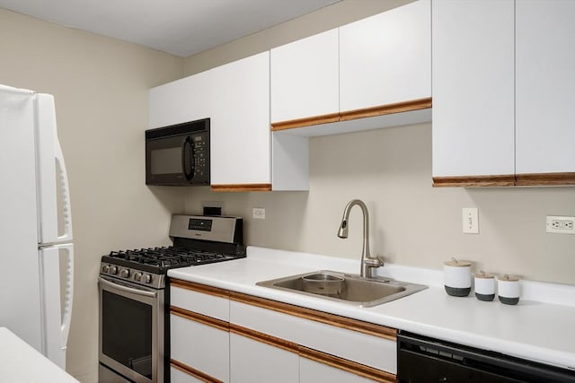 kitchen with sink, white cabinets, and black appliances