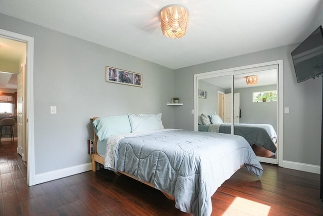 207 Belanger, Southampton, MA 01073 - bedroom with baseboards, wood finished floors, and a chandelier