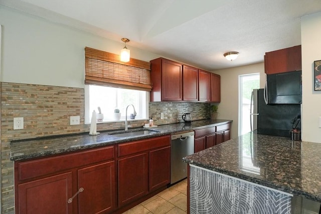 207 Belanger, Southampton, MA 01073 - kitchen with stainless steel dishwasher, a sink, decorative backsplash, and dark stone counters