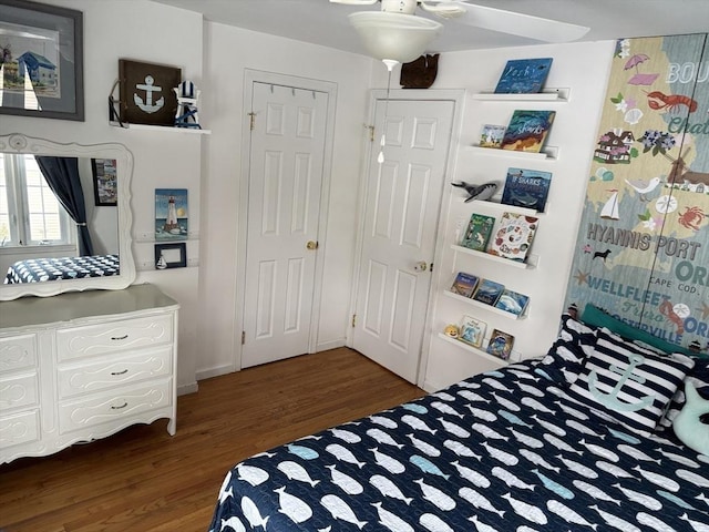 bedroom featuring dark wood-style flooring