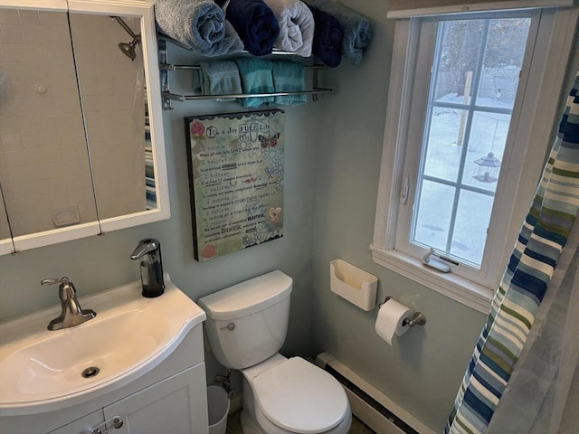 bathroom featuring toilet, curtained shower, a baseboard heating unit, and vanity