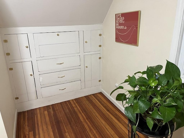 interior space featuring dark wood-style floors and baseboards