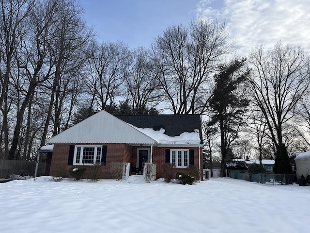 view of front of home featuring brick siding