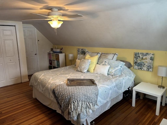 bedroom featuring lofted ceiling, a closet, dark wood finished floors, and a ceiling fan