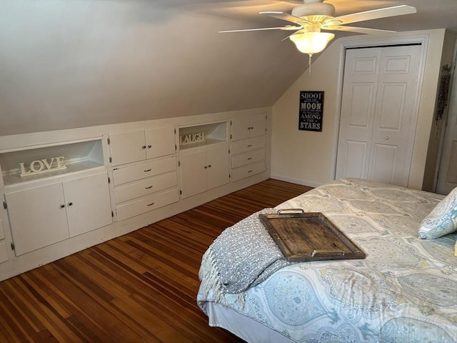 bedroom featuring a ceiling fan, a closet, dark wood finished floors, and vaulted ceiling