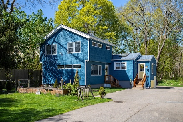 view of front of home with a front yard