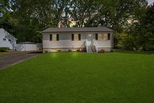 7 Edward St, Canton, MA 02021 - view of front of house with a front yard and view of scattered trees