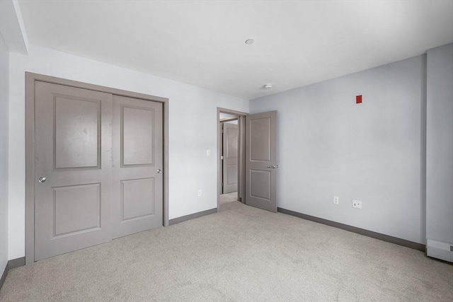 275 W Main St Unit 21, Marlborough, MA 01752 - unfurnished bedroom featuring carpet, baseboards, and a closet