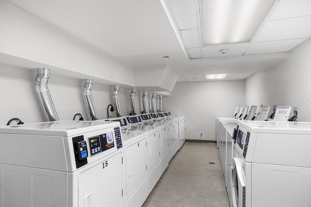 275 W Main St Unit 21, Marlborough, MA 01752 - communal laundry room with washer and clothes dryer, baseboards, and light colored carpet