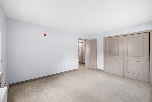 275 W Main St Unit 21, Marlborough, MA 01752 - unfurnished bedroom featuring light colored carpet, baseboards, and a closet