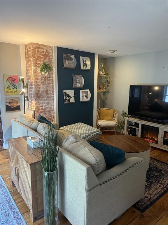 living area with wood finished floors