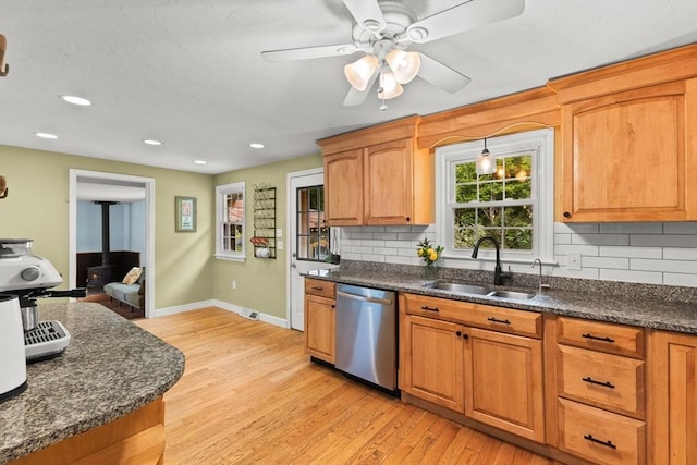 2025 S St, Bridgewater, MA 02324 - kitchen featuring stainless steel dishwasher, a sink, healthy amount of natural light, baseboards, and recessed lighting