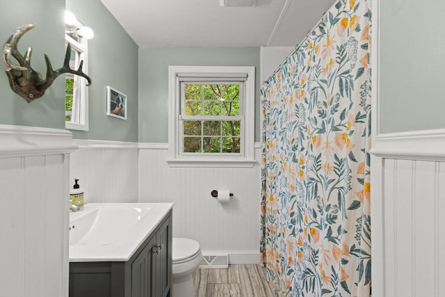 2025 S St, Bridgewater, MA 02324 - bathroom with vanity, a wainscoted wall, toilet, curtained shower, and baseboards