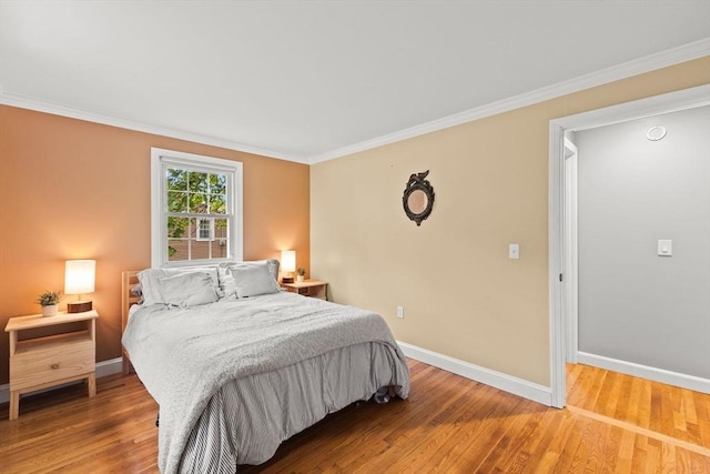 2025 S St, Bridgewater, MA 02324 - bedroom featuring baseboards, ornamental molding, and light wood-style floors