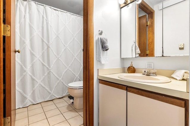 full bathroom featuring toilet, curtained shower, tile patterned flooring, and vanity