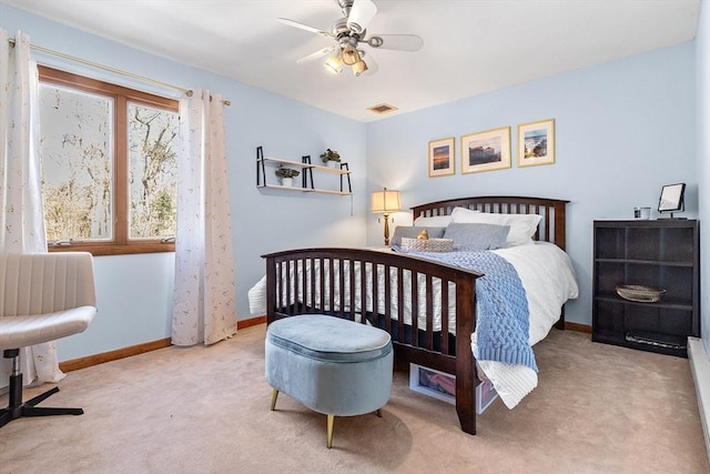 bedroom featuring a ceiling fan, baseboards, visible vents, and carpet flooring