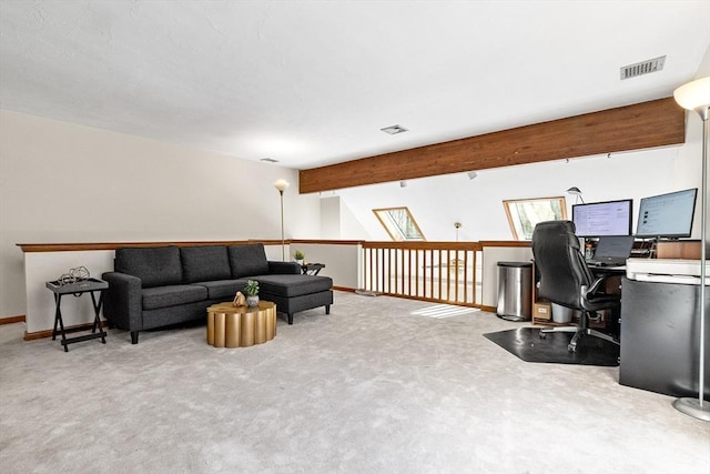 interior space with carpet floors, beam ceiling, visible vents, and baseboards