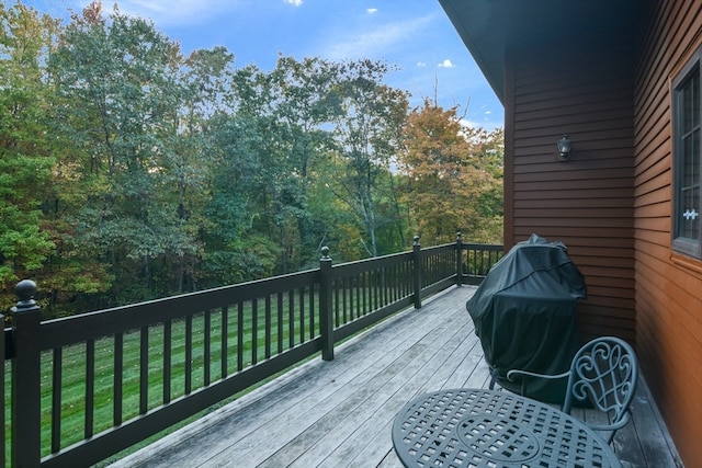 wooden deck with a yard