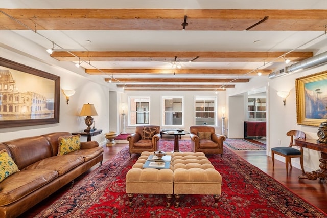 living room with hardwood / wood-style flooring and beamed ceiling