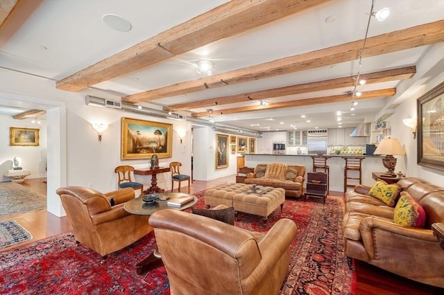 living room with beam ceiling and wood-type flooring