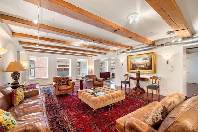 living room featuring hardwood / wood-style floors and beam ceiling