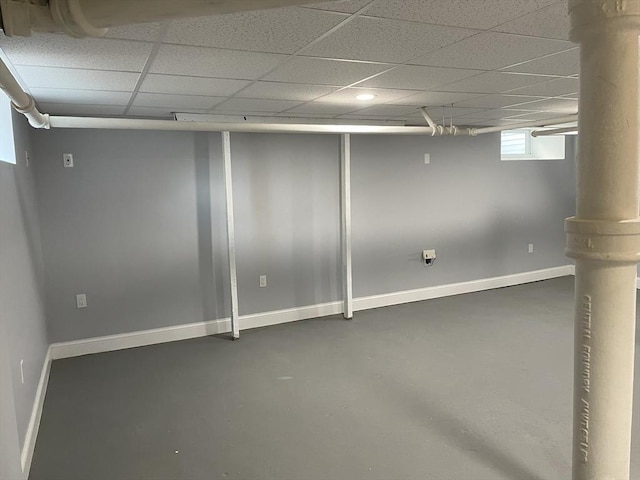 basement featuring a paneled ceiling