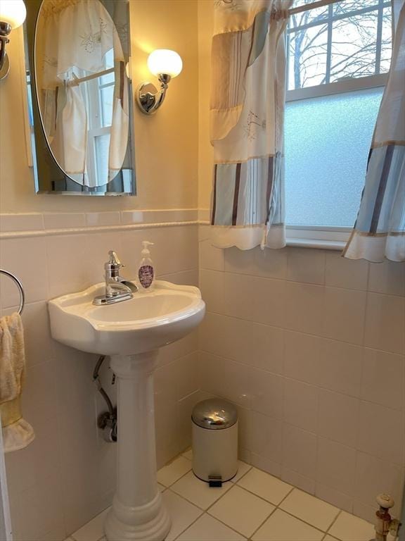 bathroom featuring tile patterned floors and tile walls