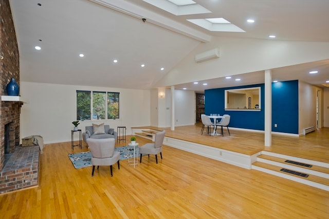 living room featuring an AC wall unit, a baseboard heating unit, a brick fireplace, and hardwood / wood-style floors