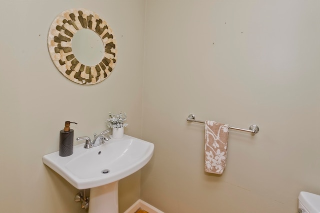 bathroom with toilet and sink