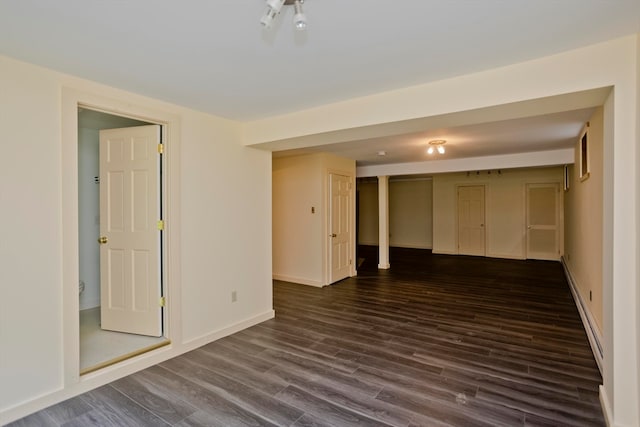 empty room featuring dark hardwood / wood-style flooring