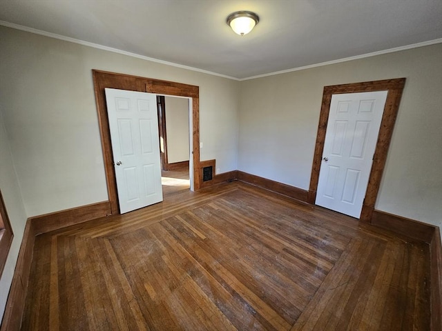 unfurnished room featuring dark hardwood / wood-style flooring and ornamental molding