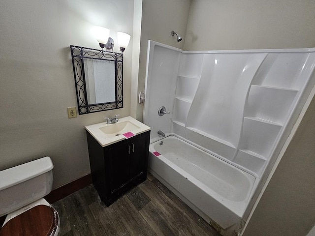 full bathroom with hardwood / wood-style flooring, vanity, toilet, and bathing tub / shower combination