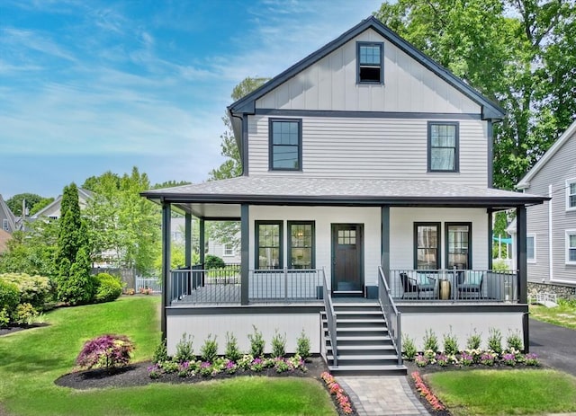 46 Pearl St, Melrose, MA 02176 - view of front of house featuring a porch, a front lawn, roof with shingles, and stairs