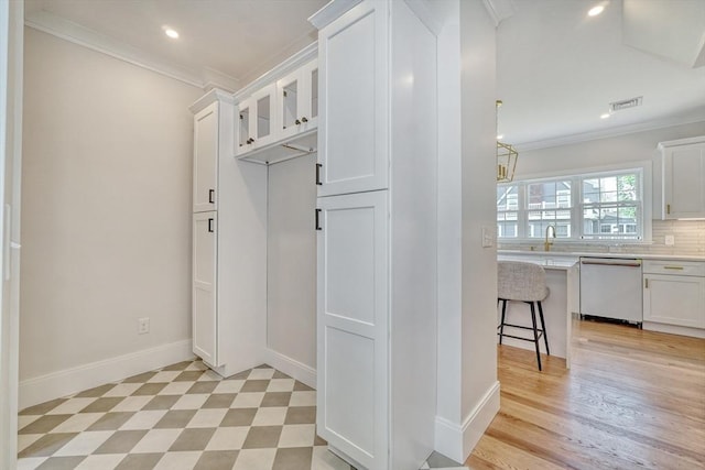 46 Pearl St, Melrose, MA 02176 - mudroom with ornamental molding, recessed lighting, and light floors