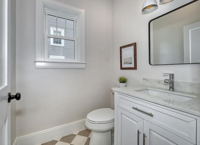 46 Pearl St, Melrose, MA 02176 - half bath featuring vanity and tile patterned floors