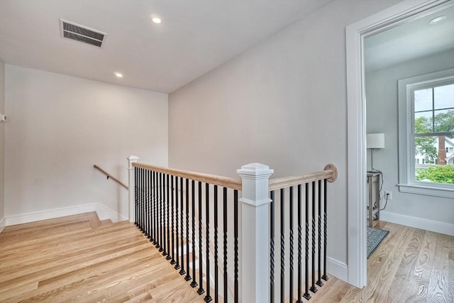 46 Pearl St, Melrose, MA 02176 - stairway with wood finished floors and recessed lighting
