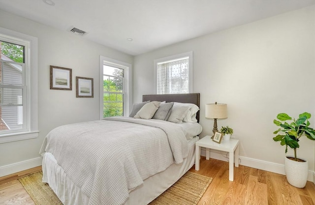 46 Pearl St, Melrose, MA 02176 - bedroom featuring multiple windows and light wood finished floors