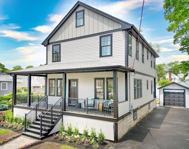46 Pearl St, Melrose, MA 02176 - view of front of home with a porch, an outbuilding, a garage, asphalt driveway, and roof with shingles