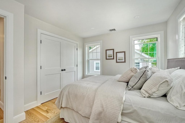46 Pearl St, Melrose, MA 02176 - bedroom with light wood-style flooring and a closet