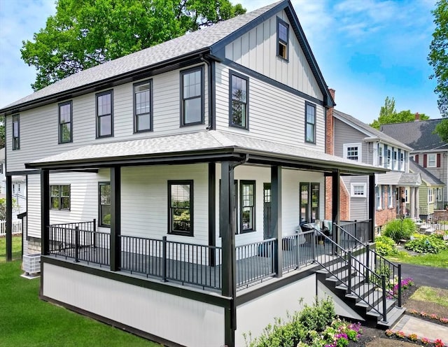 46 Pearl St, Melrose, MA 02176 - view of front of house featuring a porch, roof with shingles, and board and batten siding