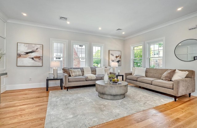 46 Pearl St, Melrose, MA 02176 - living area featuring light wood-type flooring, ornamental molding, and recessed lighting