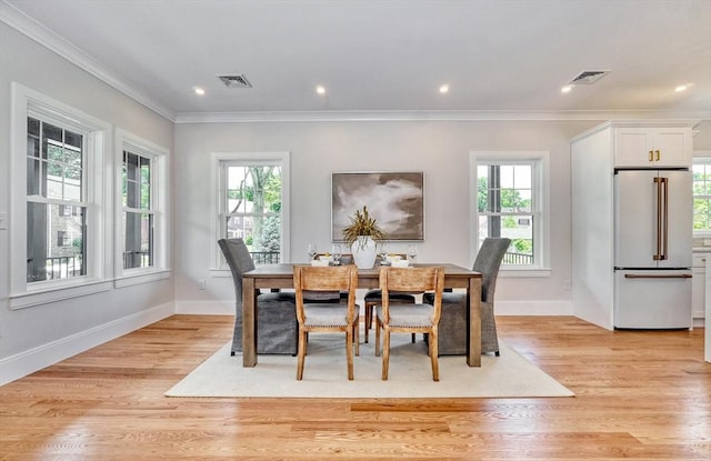 46 Pearl St, Melrose, MA 02176 - dining area featuring ornamental molding, plenty of natural light, light wood-style floors, and recessed lighting