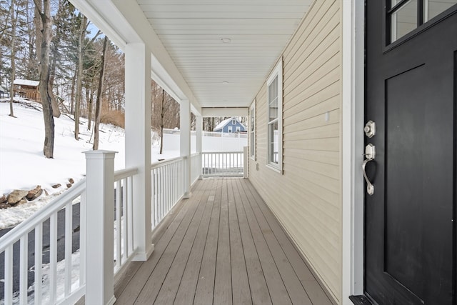 view of snow covered deck