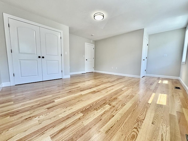 27 Pond Lane Ext, Billerica, MA 01821 - unfurnished bedroom featuring light wood-style floors and a closet