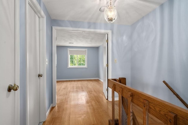 399 Pond St Unit G6, Braintree, MA 02184 - hall with light wood-type flooring and baseboards