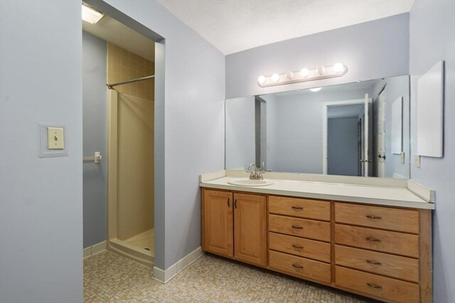 399 Pond St Unit G6, Braintree, MA 02184 - bathroom featuring vanity and a walk in shower