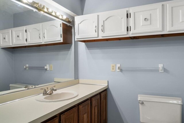 399 Pond St Unit G6, Braintree, MA 02184 - half bathroom featuring toilet and vanity
