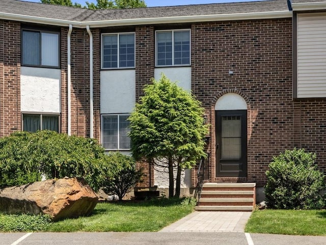 399 Pond St Unit G6, Braintree, MA 02184 - doorway to property featuring brick siding