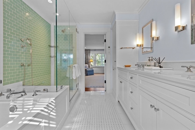 bathroom with vanity, a shower with shower door, ornamental molding, and tile patterned flooring